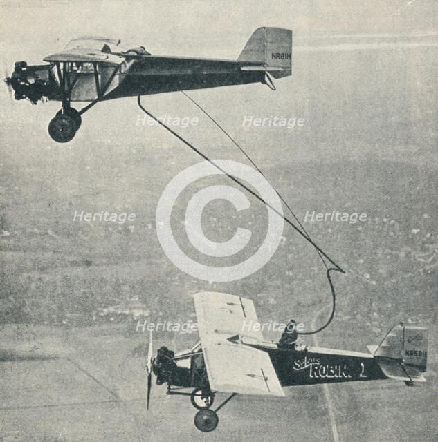 The 'St Louis Robin' refuelling, c1929 (c1937). Artist: Unknown.
