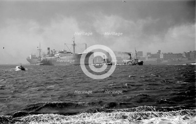The 'Stanhill' is escorted by tugs, c1945-c1965. Artist: SW Rawlings