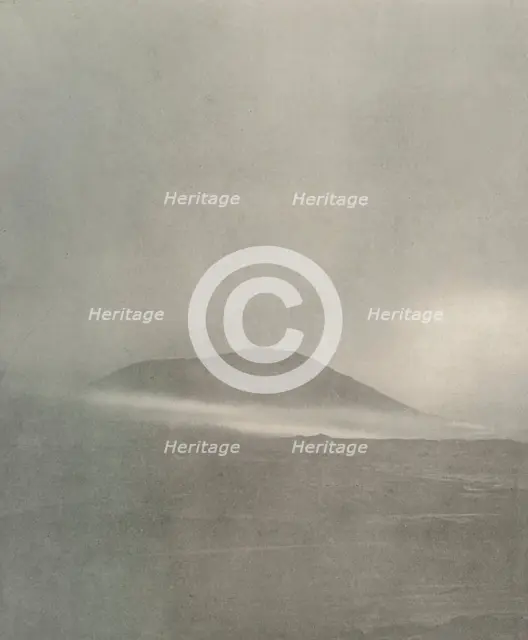 'The Start of a Blizzard...Drift Coming Round Mount Erebus', c1908, (1909). Artist: Unknown.