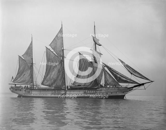 The steam yacht 'Wanderer' (later named 'Vagus') hoisting sails. Creator: Kirk & Sons of Cowes.