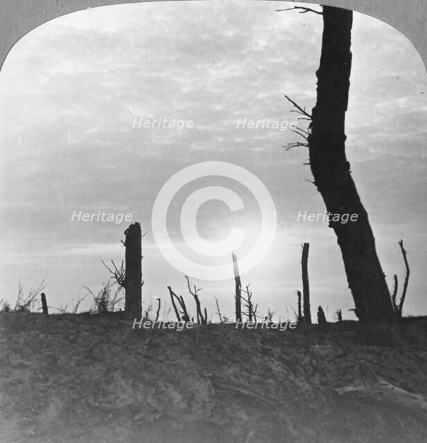 The Sun going down over 'no man's land' on the Somme, France, World War I, c1914-c1918. Artist: Realistic Travels Publishers