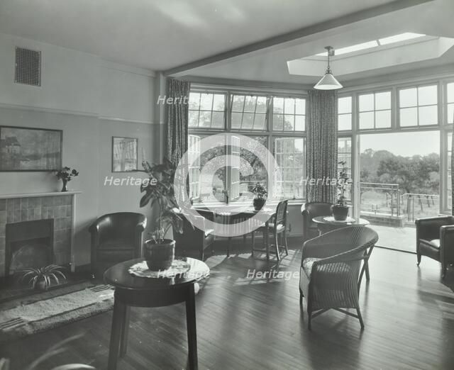 The sun lounge at Orchard House, Claybury Hospital, Woodford Bridge, London,1937. Artist: Unknown.