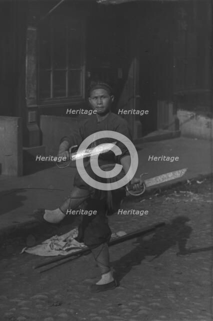 The sword dancer, Chinatown, San Francisco, between 1896 and 1906. Creator: Arnold Genthe.