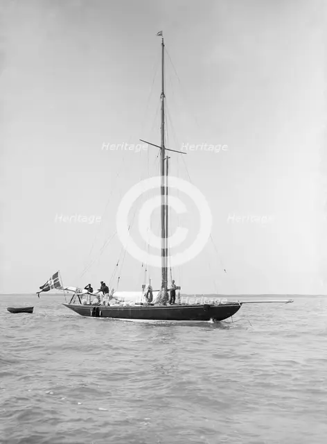 The sailing yacht 'Rollo' at anchor, 1911. Creator: Kirk & Sons of Cowes.