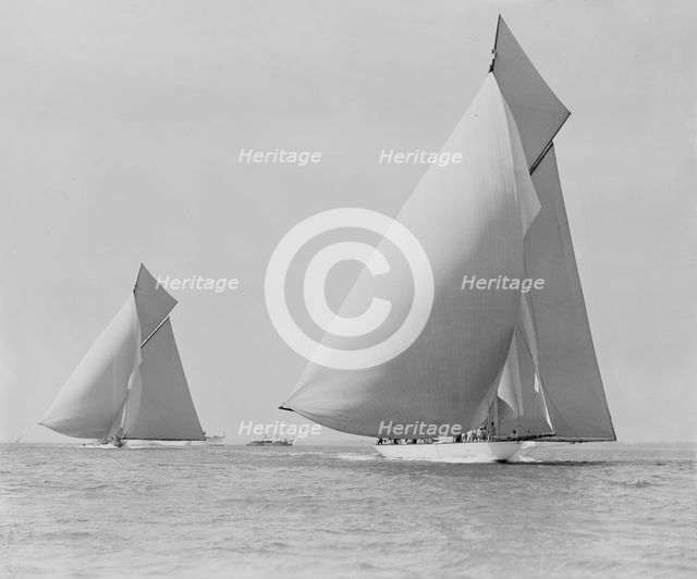 The sailing yachts 'White Heather' and 'Shamrock', race downwind. Creator: Kirk & Sons of Cowes.