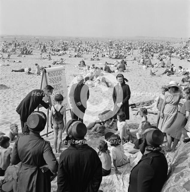 The Salvation Army runs a children's beach mission on the sand, Blackpool, c1946-c1955. Artist: John Gay