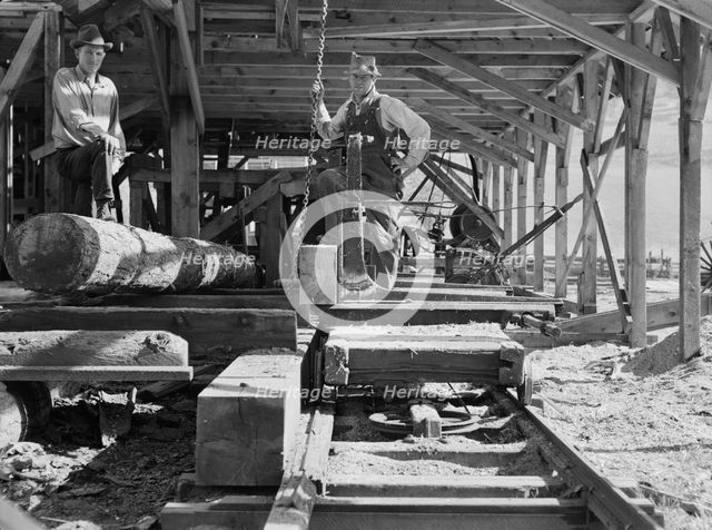 The sawmill carriage and log turner..., Ola self-help sawmill co-op, Gem County, Idaho, 1939. Creator: Dorothea Lange.