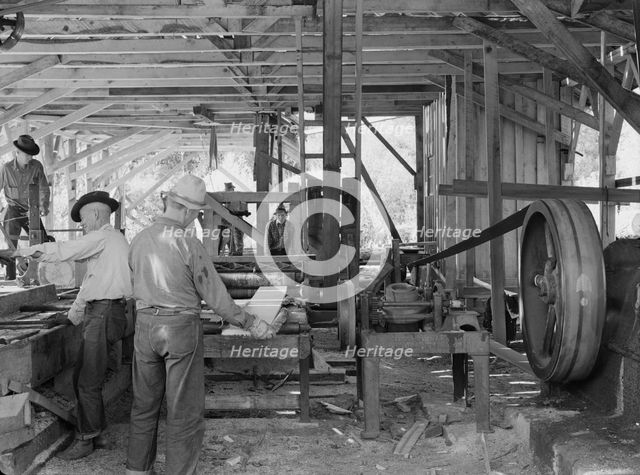 The sawmill in operation...Ola self-help sawmill co-op, Gem County, Idaho, 1939. Creator: Dorothea Lange.