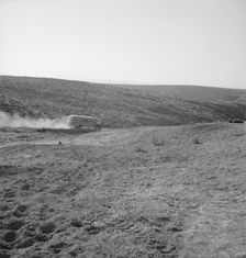 The school bus leaves the flat at eight thirty a.m. Malheur County, Oregon, 1939. Creator: Dorothea Lange