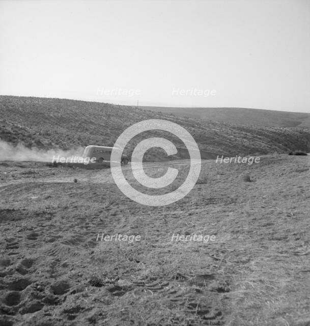 The school bus leaves the flat at eight thirty a.m. Malheur County, Oregon, 1939. Creator: Dorothea Lange.