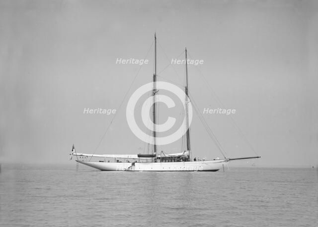 The schooner 'Joyance' at anchor, 1913. Creator: Kirk & Sons of Cowes.