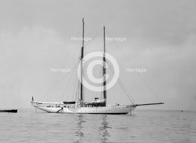 The schooner 'Joyance' at anchor, 1913. Creator: Kirk & Sons of Cowes.
