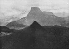 The Shadow of Adam's Peak and Bible Rock. Taken from the Peak at Sunrise c1890, (1910). Artist: Alfred William Amandus Plate
