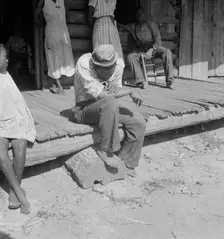 The sharecropper harvest is over in tobacco, near Tifton, Georgia, 1938. Creator: Dorothea Lange