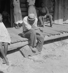 The sharecropper harvest is over in tobacco, near Tifton, Georgia, 1938. Creator: Dorothea Lange