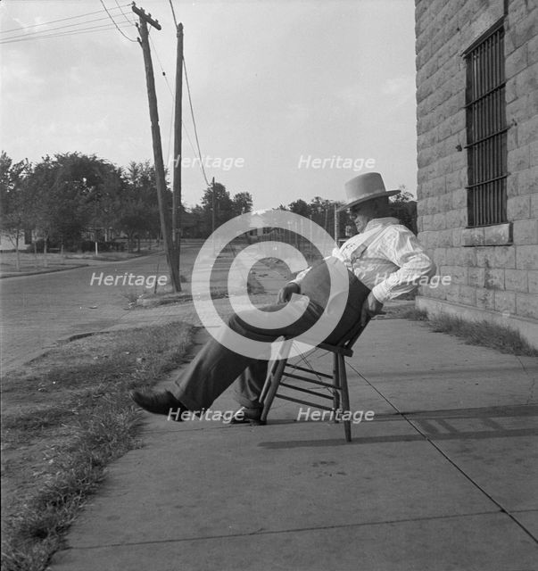 The sheriff of McAlester, Oklahoma, sitting in front of the jail, 1936. Creator: Dorothea Lange.