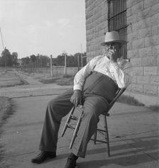 The sheriff of McAlester, Oklahoma, sitting in front of the jail, 1936. Creator: Dorothea Lange