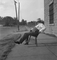 The sheriff of McAlester, Oklahoma, sitting in front of the jail, 1936. Creator: Dorothea Lange