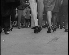 The Shoes and Legs of Crowds of People Walking the Streets of London, 1929. Creator: British Pathe Ltd