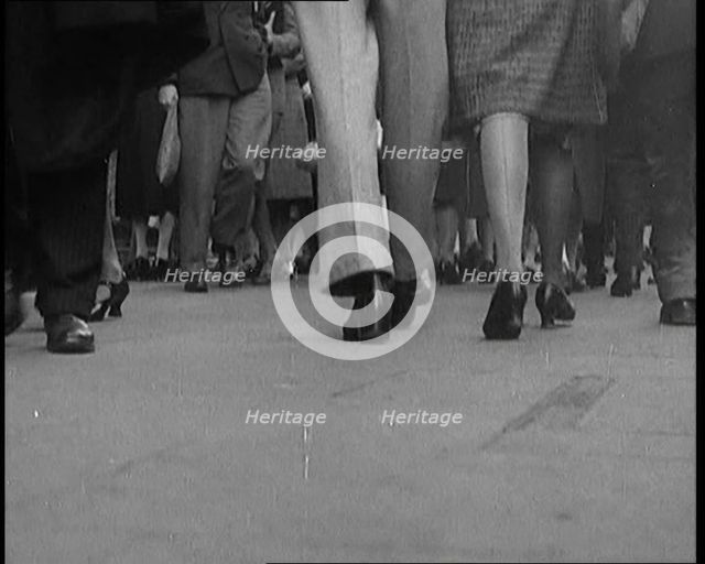 The Shoes and Legs of Crowds of People Walking the Streets of London, 1929. Creator: British Pathe Ltd.