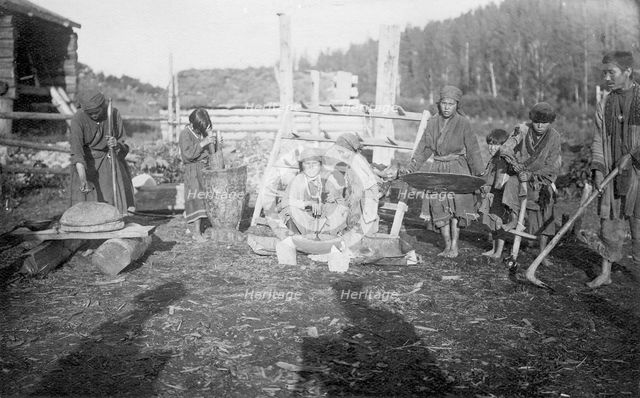 The Shors demonstrate the main tools for cultivating the land (hoe - "abyl", harrow) and..., 1913. Creator: GI Ivanov.