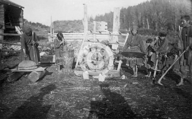 The Shors demonstrate the main tools for cultivating the land (hoe - "abyl", harrow) and..., 1913. Creator: GI Ivanov.