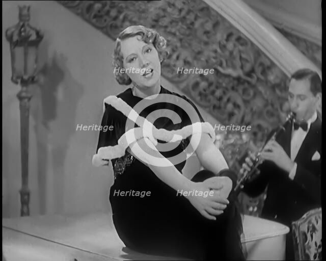 The Singer Elsie Carlisle and Her Band Performing a Song About Her Boyfriend Who Has Gone..., 1931. Creator: British Pathe Ltd.
