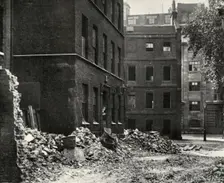 The Site of the Gateway from Fetter Lane and the Derelict Houses Awaiting Demolition 1934. Creator: Unknown