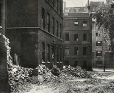 The Site of the Gateway from Fetter Lane and the Derelict Houses Awaiting Demolition 1934. Creator: Unknown