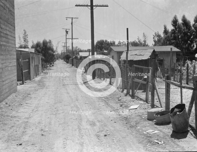 The slums of Brawley, Homes of Mexican field workers, Imperial Valley, California, 1935. Creator: Dorothea Lange.