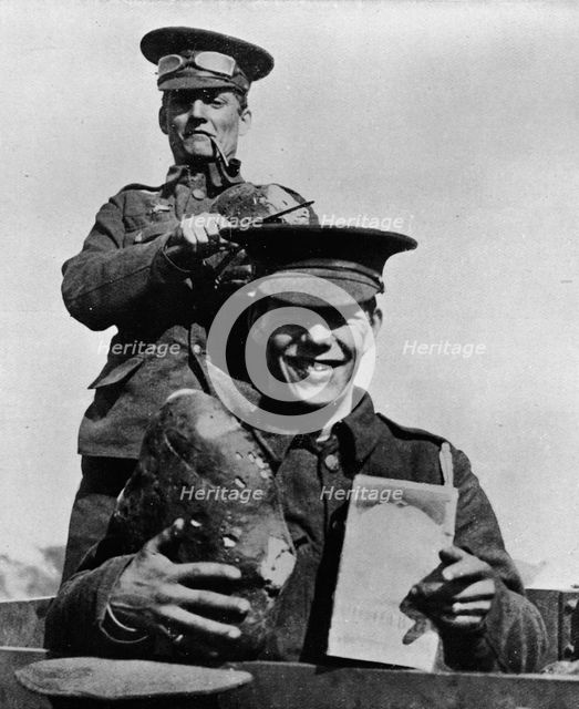 'The Soldier and his Rations: A photograph taken at one of the British camps in France', 1914. Artist: Unknown.