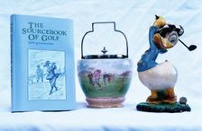"The Sourcebook of Golf", ornamental ware, Donald Duck figure, 1930-81. Creator: Unknown
