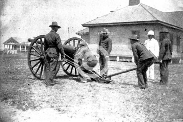 The Spanish-American War: American naval and military types - sighting gun for action, 1898. Creator: Unknown.