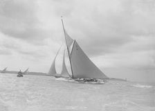 The spectacular 15 Metre Vanity sailing in a good wind, 1912. Creator: Kirk & Sons of Cowes