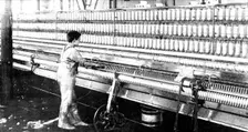 The spinning-mule, on which both warp and weft are spun, 1909. Creator: Unknown