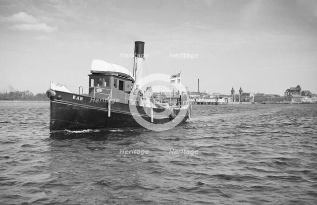 The tugboat 'Ran' leaving Landskrona, harbour, Sweden, 1935. Artist: Unknown