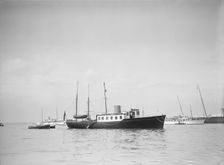 The twin screw 80ft motor yacht Bystander at anchor, 1934. Creator: Kirk & Sons of Cowes