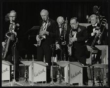 The Ted Heath Orchestra in concert at the Barbican Hall, London, 5 December 1985. Ronnie Chamberlain Artist: Denis Williams