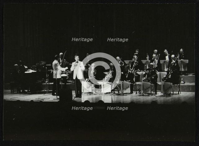 The Ted Heath Orchestra in concert at the Barbican Hall, London, December 1985. Artist: Denis Williams