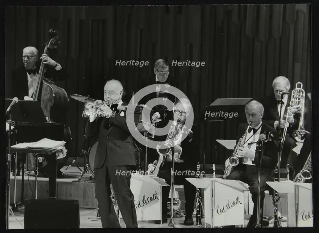 The Ted Heath Orchestra in concert, London 1985. Pictured are Lennie Bush (double bass), Kenny Baker Creator: Denis Williams.