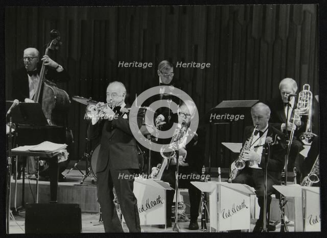 The Ted Heath Orchestra in concert, London 1985. Pictured are Lennie Bush (double bass), Kenny Baker Artist: Denis Williams