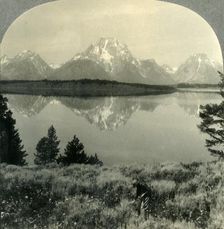 The Teton Mountains across Jackson Lake, near Yellowstone Nat. Park, Wyo. c1930s. Creator: Unknown