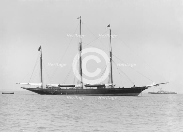 The three mast auxiliary sailing yacht 'Utopia' at anchor, 1913. Creator: Kirk & Sons of Cowes.
