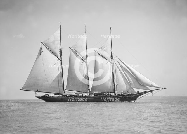The three-mast auxiliary schooner 'Invincible', 1911. Creator: Kirk & Sons of Cowes.