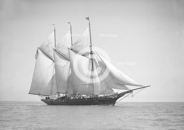 The three-mast auxiliary schooner 'Invincible', 1911. Creator: Kirk & Sons of Cowes.