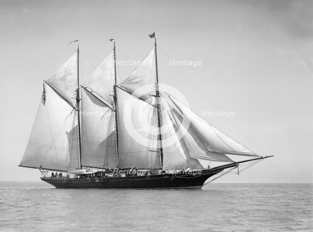 The three-mast auxiliary schooner 'Invincible', 1911. Creator: Kirk & Sons of Cowes.