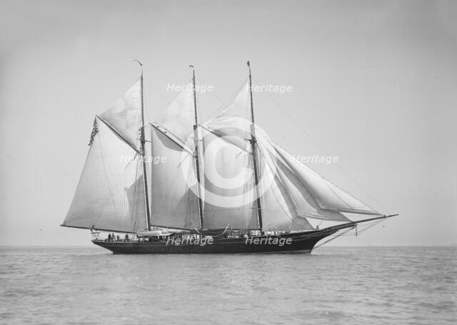 The three-mast auxiliary schooner 'Invincible', 1911. Creator: Kirk & Sons of Cowes.
