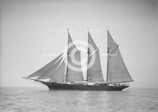 The three-mast auxiliary schooner 'Invincible', 1911. Creator: Kirk & Sons of Cowes.