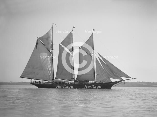 The three-mast auxiliary schooner 'Invincible', 1911. Creator: Kirk & Sons of Cowes.