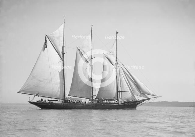 The three-mast auxiliary schooner 'Invincible', 1911. Creator: Kirk & Sons of Cowes.